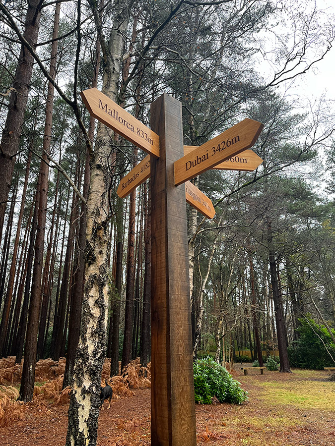 wood road distance sign